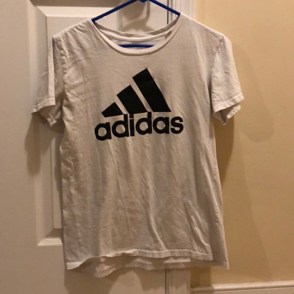 A white t-shirt with The adidas logo